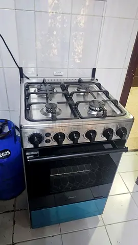Used freestanding gas stove with oven - 4 burners, stainless top