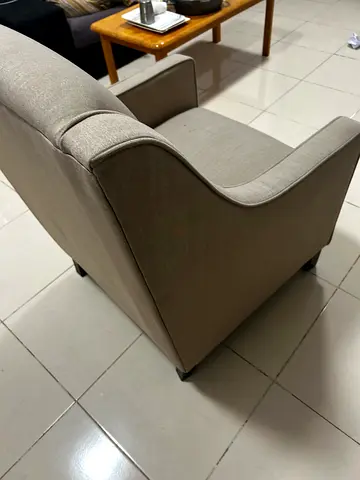 Single beige fabric armchair in good used condition