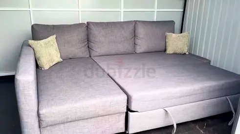 Comfortable Grey L-Shaped Sofa Bed with Cushions