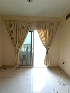 For annual rent in cooperation with Sharjah Two-bedroom apartment with a living room and a balcony