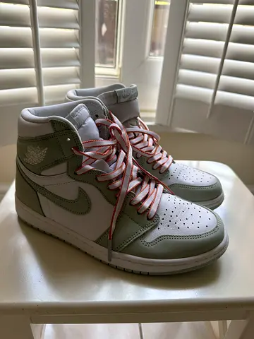 Pair of womens Nike Air Jordan 1-style high-top sneakers, size available