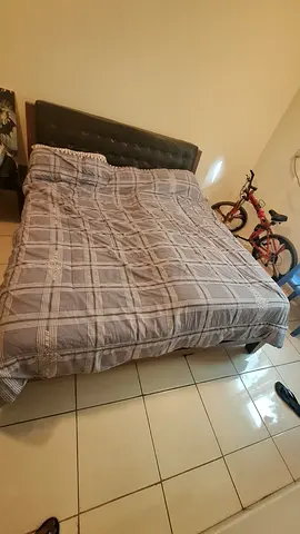 Queen size bed with padded headboard — used, good condition