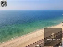For Sale – Luxury Apartment with Direct Sea View in Corniche Residences – Ajman**