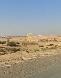 Two adjacent plots of land for sale in Al-Sahma area, Al-Ruwaidhat suburb. Each plot is 3000 square