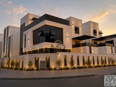 Luxury corner villa for sale on two paved streets in Al Helio | Prime location near the mosque and Sheikh Mohammed Bin Zayed Road | Ground floor + two