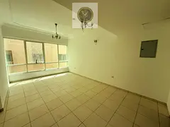 One bedroom apartment with a living room balcony and two bathrooms for annual rent in Al Taawun Buil