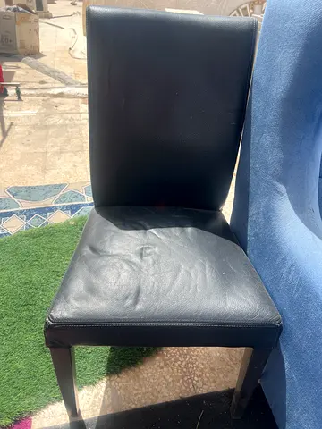 Set of 2 black faux leather dining chairs — sturdy, used
