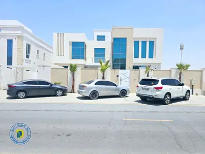 Prime location in Al Yasmin, luxury villa with 6 bedrooms, roof terrace, and swimming pool, including electricity, water, and air conditioning.