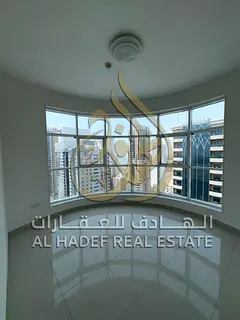 2 bedroom apartment Al Khan balcony free parking gym pool central AC built in wardrobes