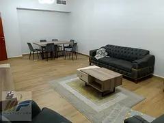 Own a ready-to-move-in two-bedroom apartment in Ajman with a monthly installment of 5600 dirhams, cl