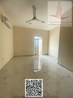 Two rooms and a living room for rent in Al Muwaihat 2/02 with a balcony