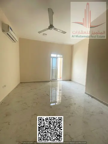 Two rooms and a living room for rent in Al Muwaihat 2/02 with a balcony