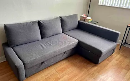 Gray L-shaped Sofa bed with Chaise — Good Condition