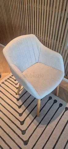 Light grey upholstered dining/occasional chair with wooden legs. 8 available