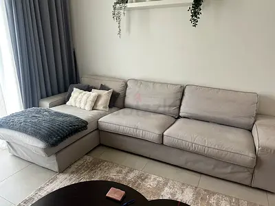 Light grey L-shaped fabric sofa with chaise - good condition