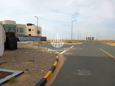 Land for building a villa on the main street next to the Masaar project, installments over 24 months