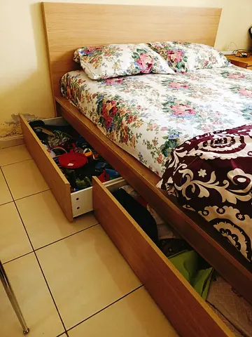 Double bed with built-in storage drawers - light wood finish