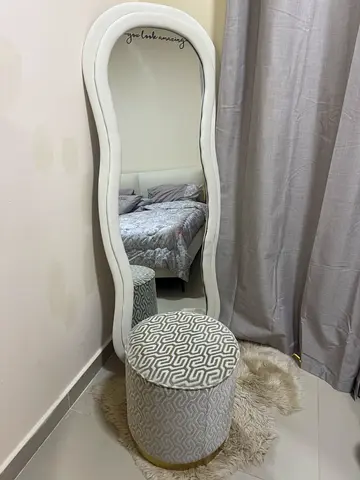 Modern Wavy Full Length Mirror with Patterned Ottoman and Faux Fur Rug