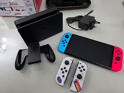 Nintendo Switch OLED console with dock, Joy‑Cons and accessories (Mint condition)