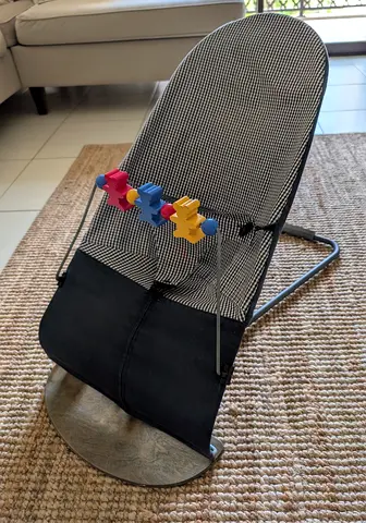 BabyBjorn bouncer chair with wooden toy bar. Spare cover included - used, good condition