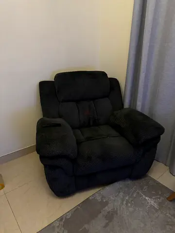 Comfortable single black recliner armchair - good condition