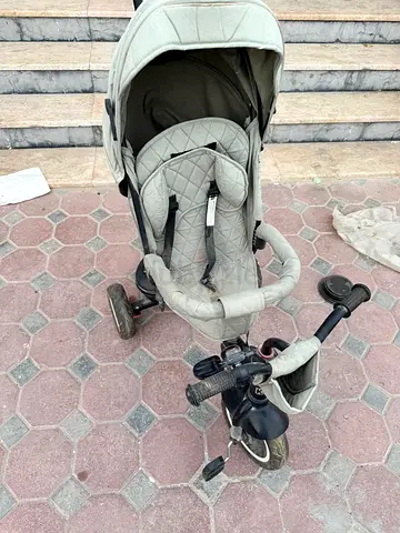Used convertible tricycle stroller with canopy – light grey