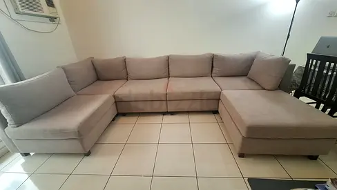 Light grey L-shaped sectional sofa — comfortable 6-seater, good condition