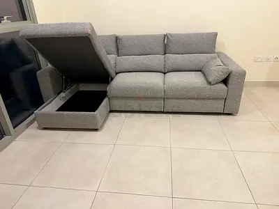 Ikea gray Eskilstuna sofabed with storage space