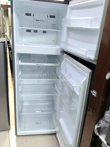 Used double-door refrigerator, clean interior, working condition