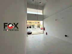 Shop for annual rent in Al Muwaihat 3, Ajman, on a main street, with an area of ​​900 feet, suit