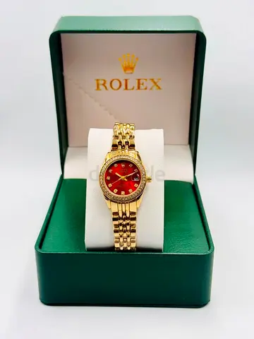 Rolex gold-tone womens wristwatch with red dial in box