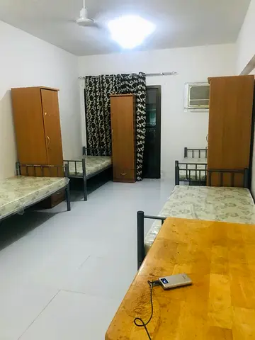 Room- male bachelors- 8 in room - attached Balcony- Sep Bath- Directly from owner- Karama