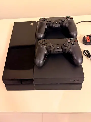Ps4 with 2 controllers and 13 Game CDs for Sale