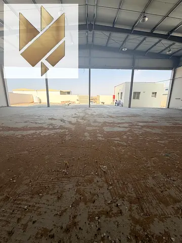 Factory for rent in Al Sajaa with a large warehouse area. Approximate area: 10,000 sq. ft. Power capacity: 70 kW