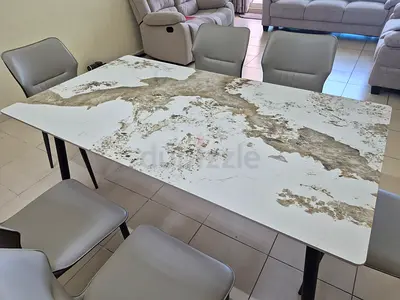 Dining table with patterned marble top and 6 chairs