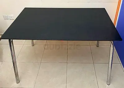 Black rectangular dining/office table with chrome legs - sturdy, good condition