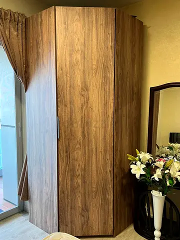 Corner wooden wardrobe / armoire in very good condition