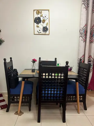 Solid Wood Dining Table with 4 Carved Chairs - Good Condition