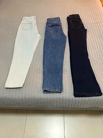Three pairs of womens jeans - dark, medium and light wash, size approx XS,M