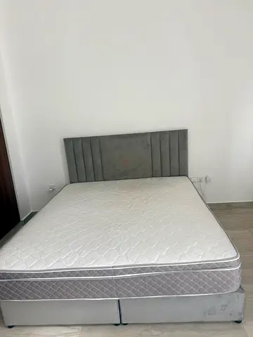 Premium King Size Bed (180x200 cm) with Mattress and 
a brand new, unused set of a premium pillows.