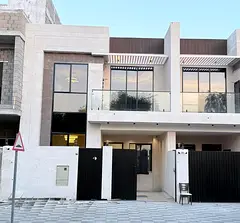 For sale in Al Yasmin: Townhouse with 4 bedrooms, living room, and sitting room.