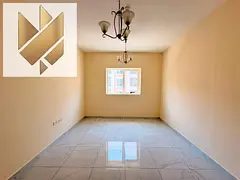 one-bedroom apartment with a living room in Al Muwaileh New