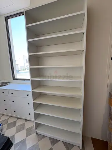 Tall white bookshelf / storage unit - good condition
