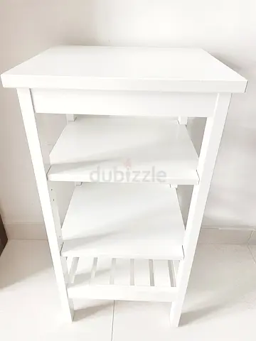 White wooden side table with shelving