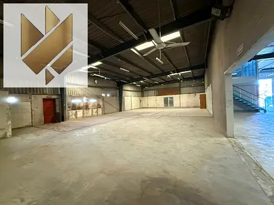 Massive warehouse for rent on a main road in Industrial Area 10, Sharjah, with a total area of 20,000 sq. ft., suitable for large-scale commercial.