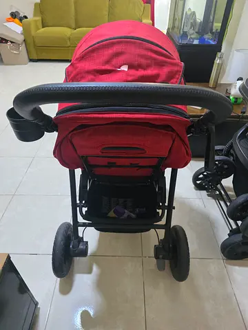 Red baby stroller in good used condition, Joie