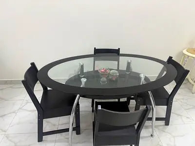 Round Glass Top Dining Table with 4 Black Chairs