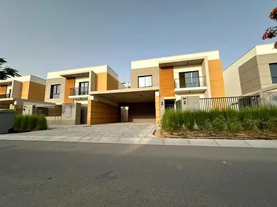 First occupancy villa for annual rent in Al Amerah Ajman, 5 bedrooms, living room, maid room, 5 bathrooms, 15 min from Sharjah Airport, Azha Community