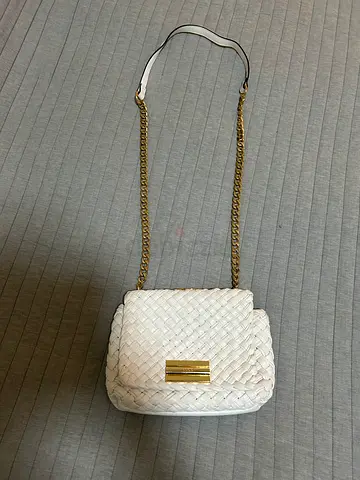 White woven crossbody bag with gold chain strap