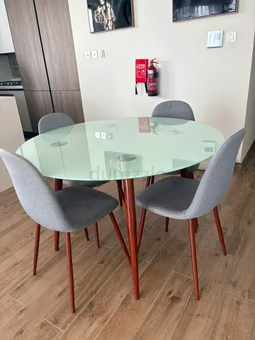 Glass Top Round Dining Table with 4 Grey Fabric Chairs